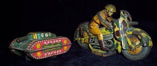 Appraisal: A tinplate camouflaged motor bicycle with uniformed rider and machine