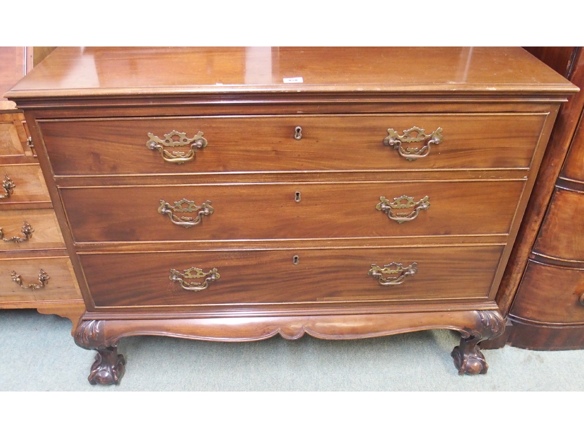 Appraisal: A Victorian mahogany three graduated chest of drawers on a