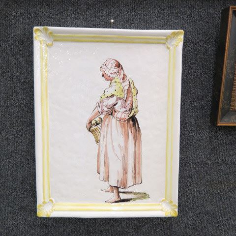 Appraisal: Italian Pottery Plaque of Peasant Woman with basket of fruit