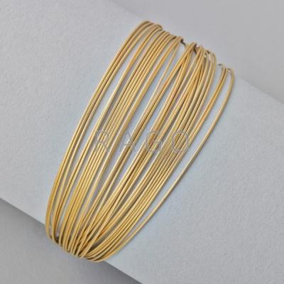 Appraisal: TIFFANY CO K GOLD MULTI CABLE BRACELET semi-rigid wires join