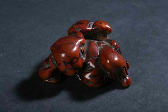 Appraisal: JAPANESE WOOD NETSUKE OF MAN Meiji Period - in long