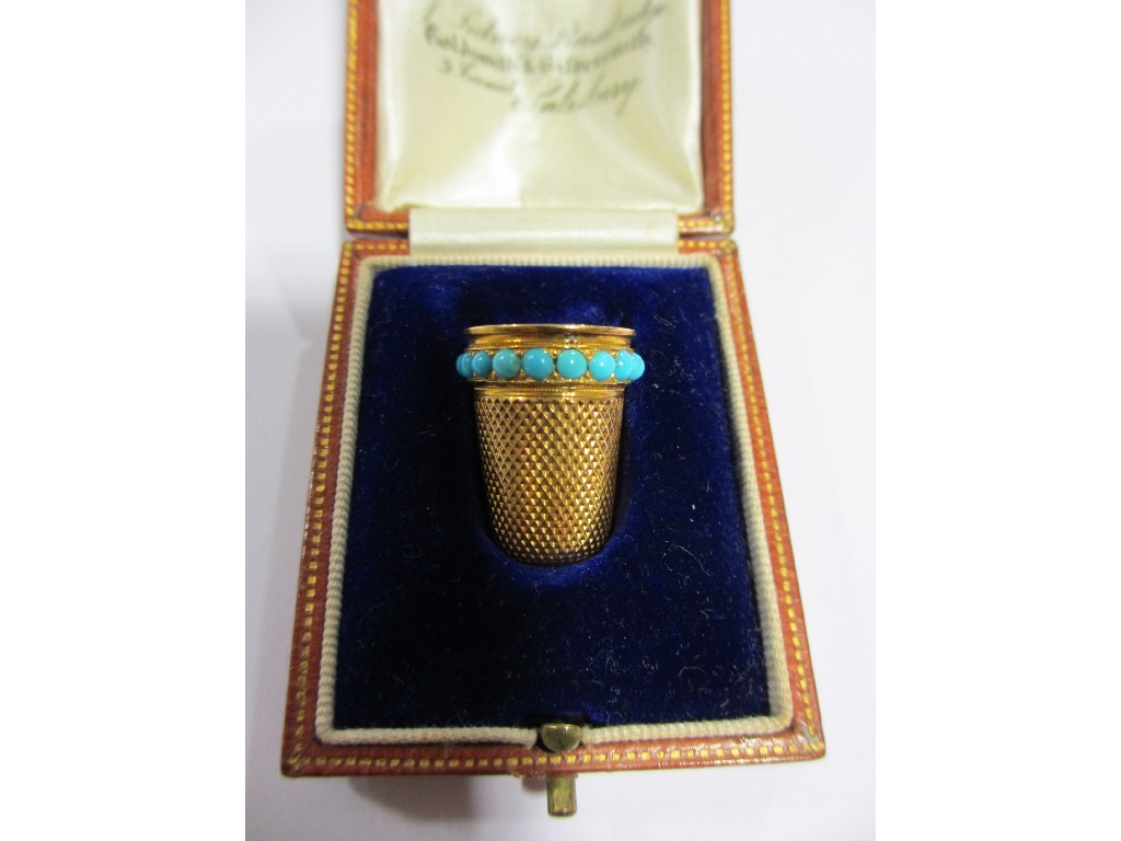 Appraisal: A yellow metal thimble with turquoise insets in original fitted