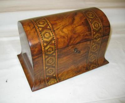 Appraisal: A VICTORIAN WALNUT TEA CADDY of domed form with parquetry