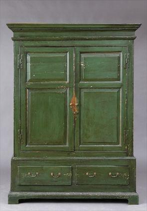 Appraisal: GREEN-PAINTED PINE LIVERY CUPBOARD The removable molded cornice above a