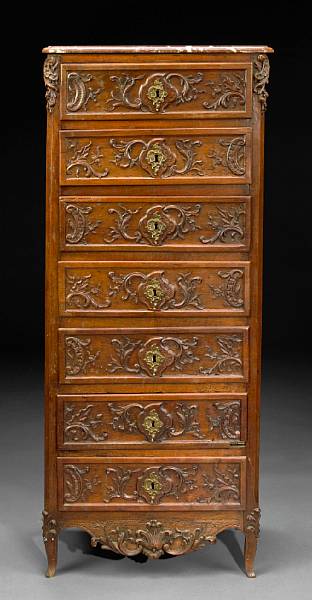 Appraisal: A Louis XV carved walnut semainier Surmounted by a marble