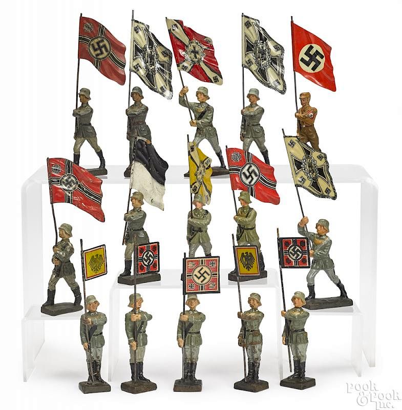 Appraisal: Lineol painted composition soldier flag bearers Lineol painted composition flag