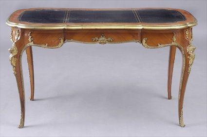 Appraisal: LOUIS XV-STYLE GILT-BRONZE MOUNTED KINGWOOD BUREAU PLAT The shaped top