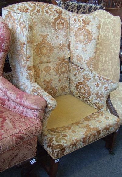 Appraisal: A George III and later wing armchair with loose cushion