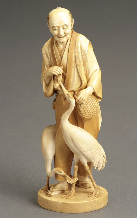 Appraisal: Japanese Partial Tea-Stained Ivory Okimono of a Man Feeding Fish