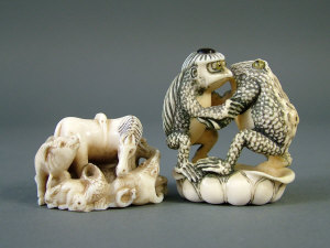 Appraisal: A th century Japanese netsuke carved as two frogs signed