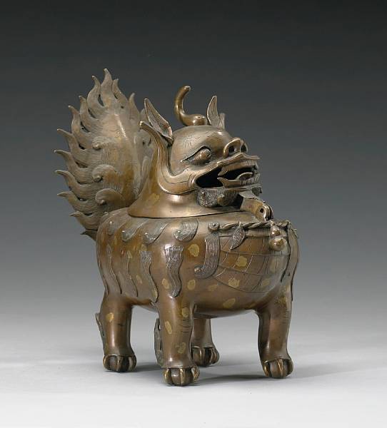 Appraisal: A cast bronze qilin censer Qing Dynasty Its head with