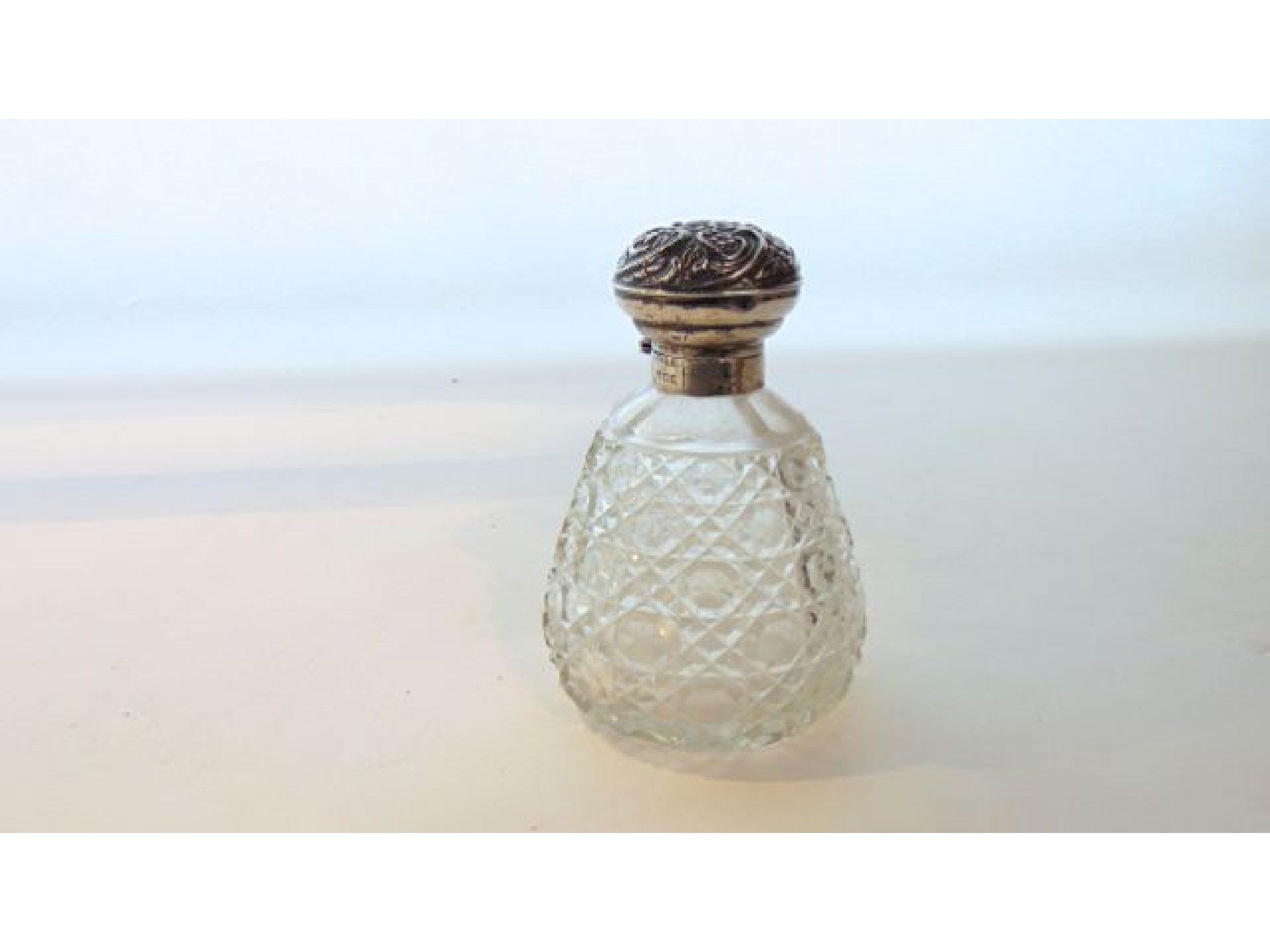 Appraisal: An Edwardian silver-mounted cut-glass toilet bottle Henry Matthews Birmingham the