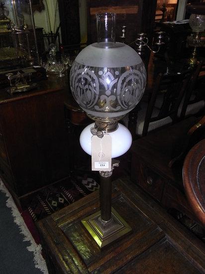 Appraisal: A BRASS CORINTHIAN COLUMN OIL LAMP with stencilled globe shade