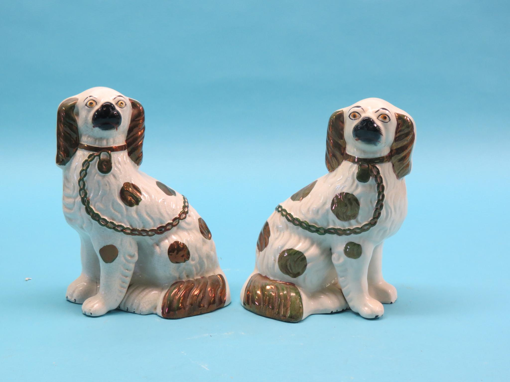 Appraisal: A pair of Victorian Staffordshire comforter spaniels with separately-cast front