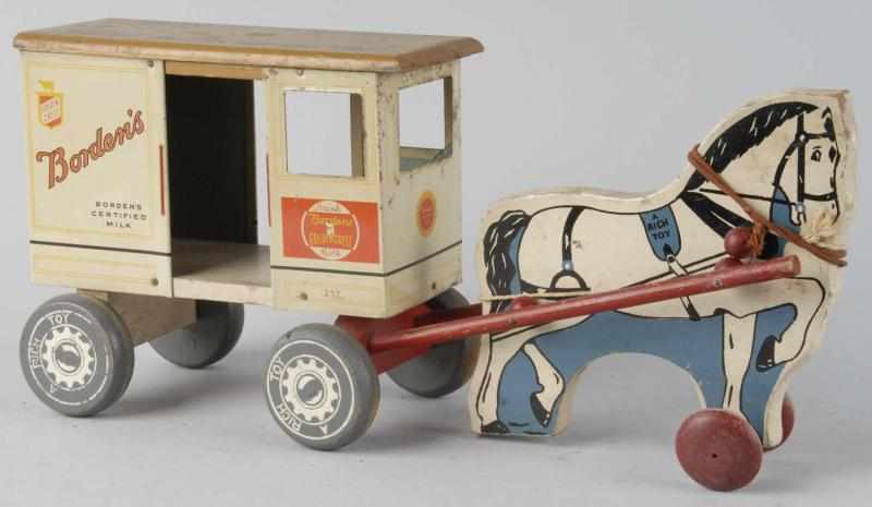 Appraisal: Rich Toys Borden's Horse-Drawn Milk Wagon Description Wood and tin