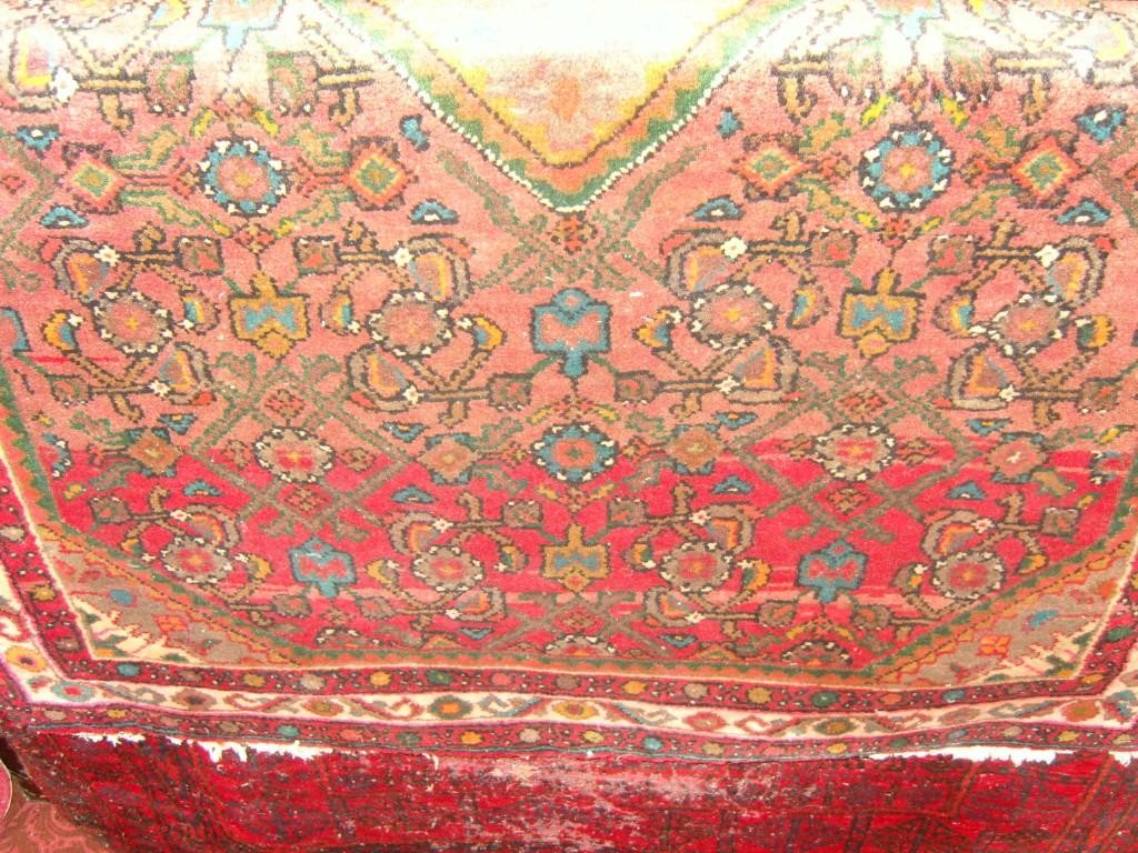 Appraisal: Two eastern wool rugs with stylised floral and geometric decoration