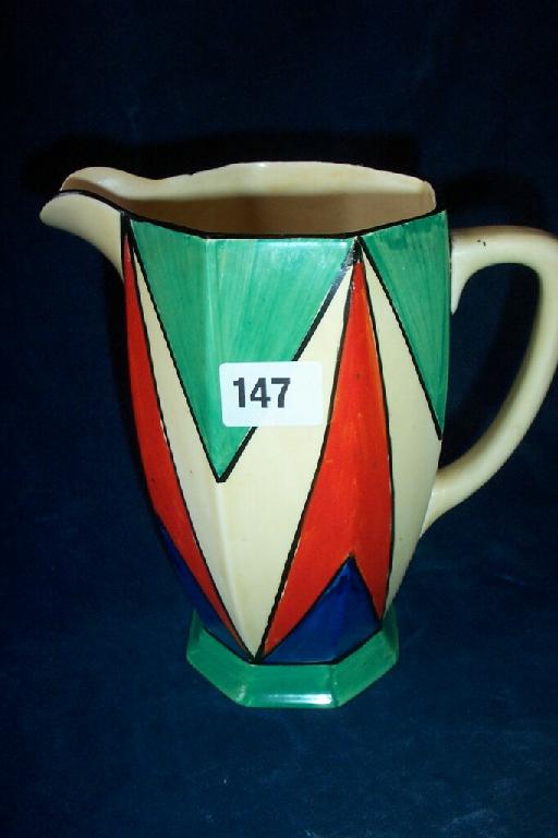 Appraisal: A Clarice Cliff Bizarre jug of octagonal form with painted