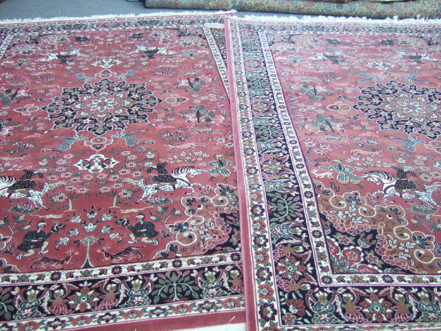 Appraisal: A pair of machine made Persian style carpets the pink