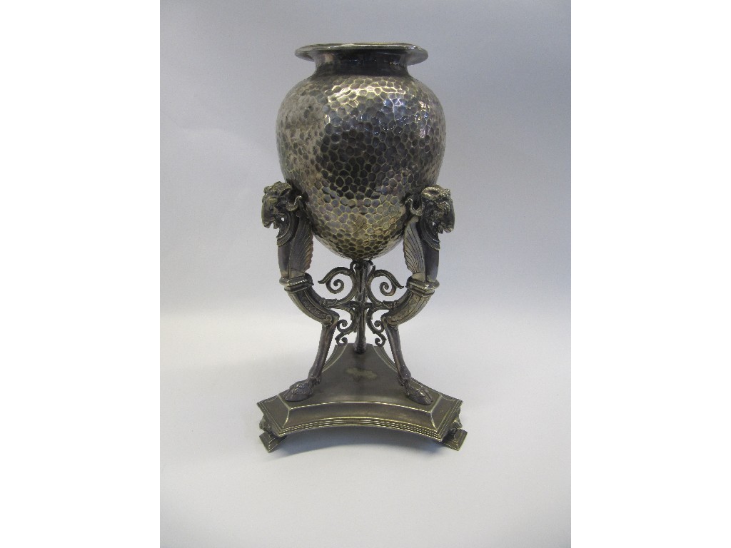 Appraisal: A silver plated centrepiece vase supported by ram's heads with