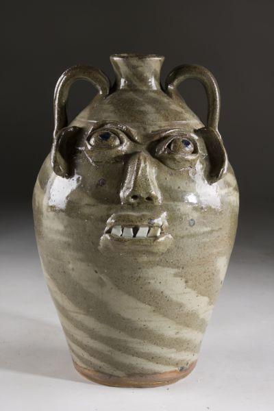 Appraisal: NC Folk Pottery Burlon Craig Face Jug two color swirl