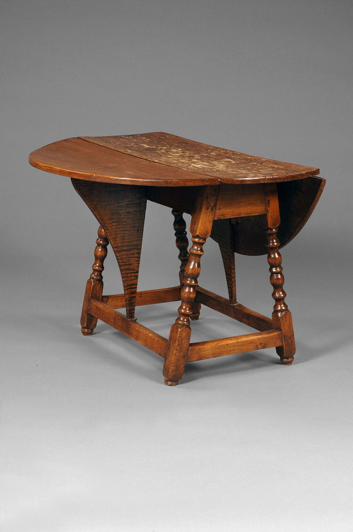 Appraisal: EARLY AMERICAN TIGER MAPLE AND MAPLE BUTTERFLY TABLE The hinged