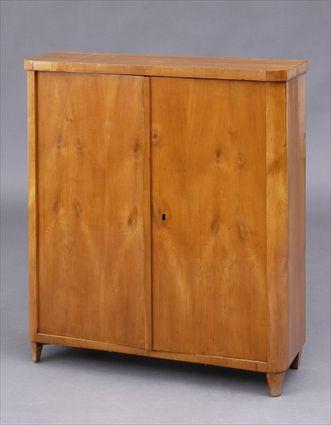 Appraisal: BIEDERMEIER FRUITWOOD TWO-DOOR SIDE CABINET The top with rounded front