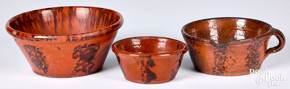 Appraisal: Three Pennsylvania redware bowls th c with ma Three Pennsylvania