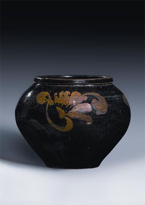 Appraisal: A Chinese Henan black-glazed and russet splashed jar decorated with