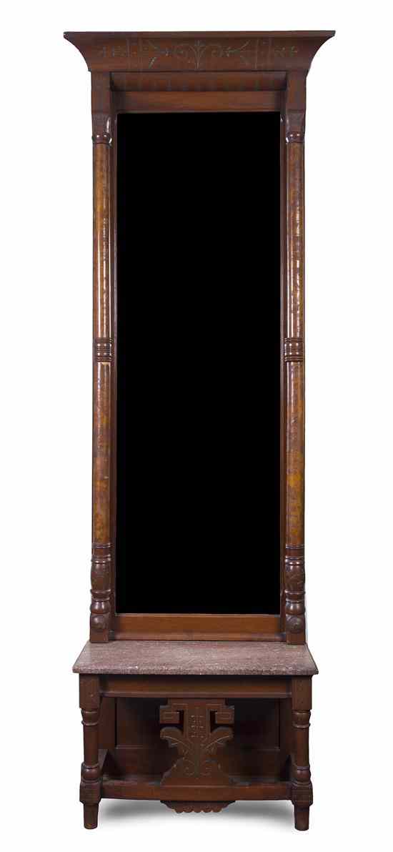 Appraisal: A Victorian Walnut Pier Mirror having a flared cornice over