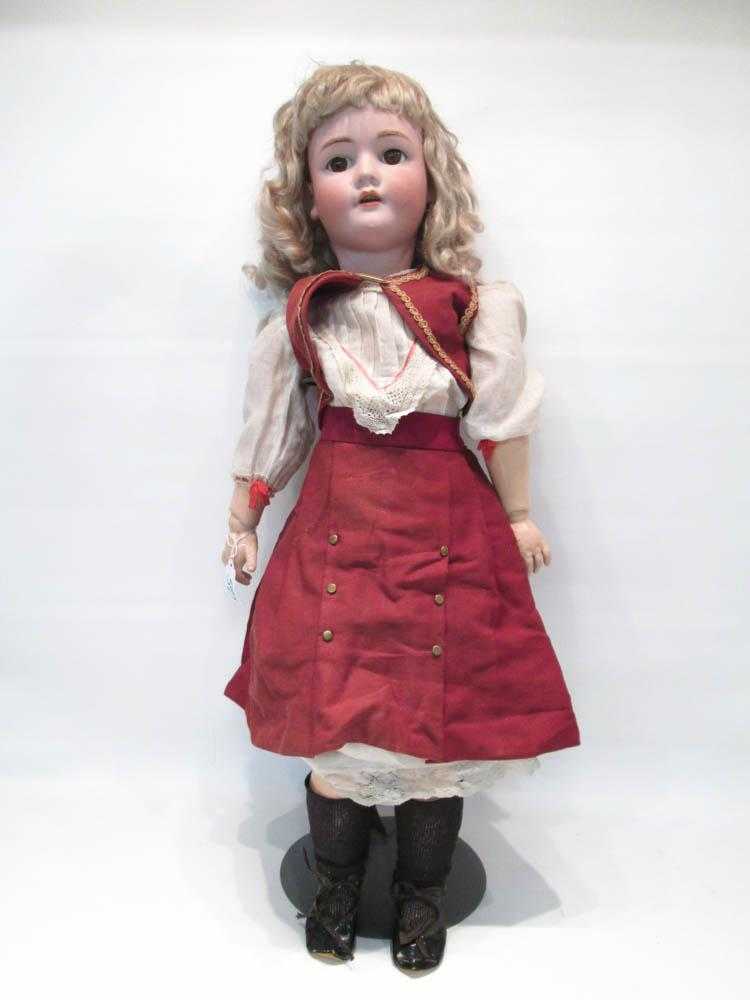 Appraisal: HEINRICH HANDWERCK GIRL DOLL in human hair blond wig brown