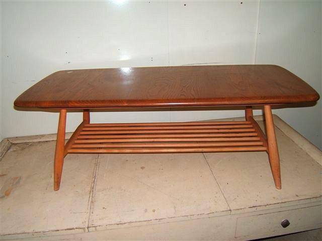 Appraisal: A light elm and beech Ercol coffee table with shaped