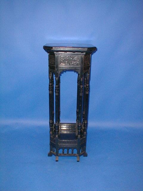 Appraisal: An ebonised aesthetic movement jardiniere stand of canted square form