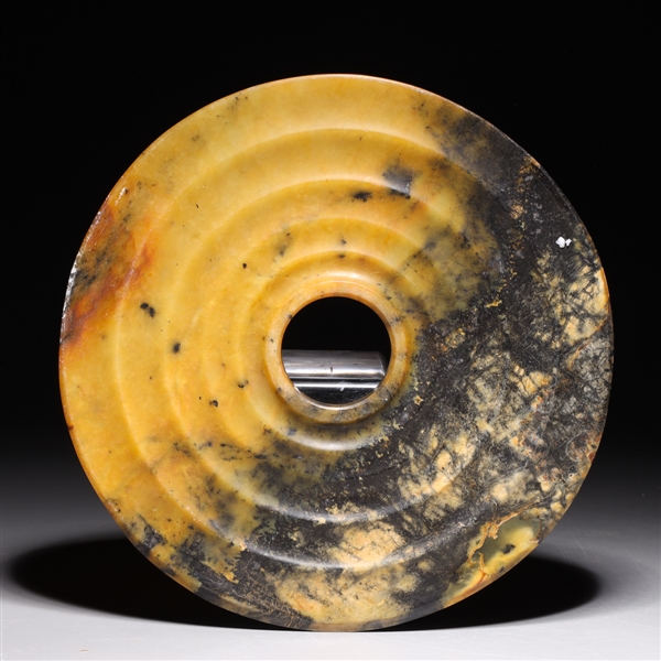 Appraisal: Chinese hardstone archaistic bi with concentric rings to surface overall