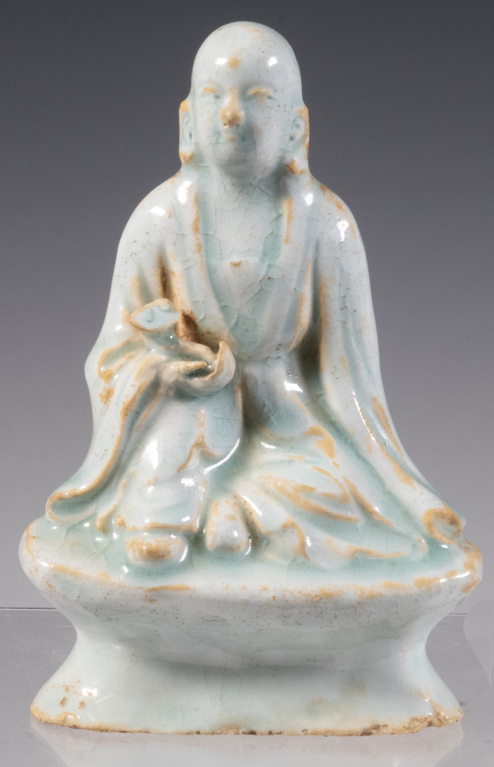 Appraisal: CHINESE QINGBAI GLAZED BUDDHA FIGURE Ming Dynasty Glazed Porcelain Seated