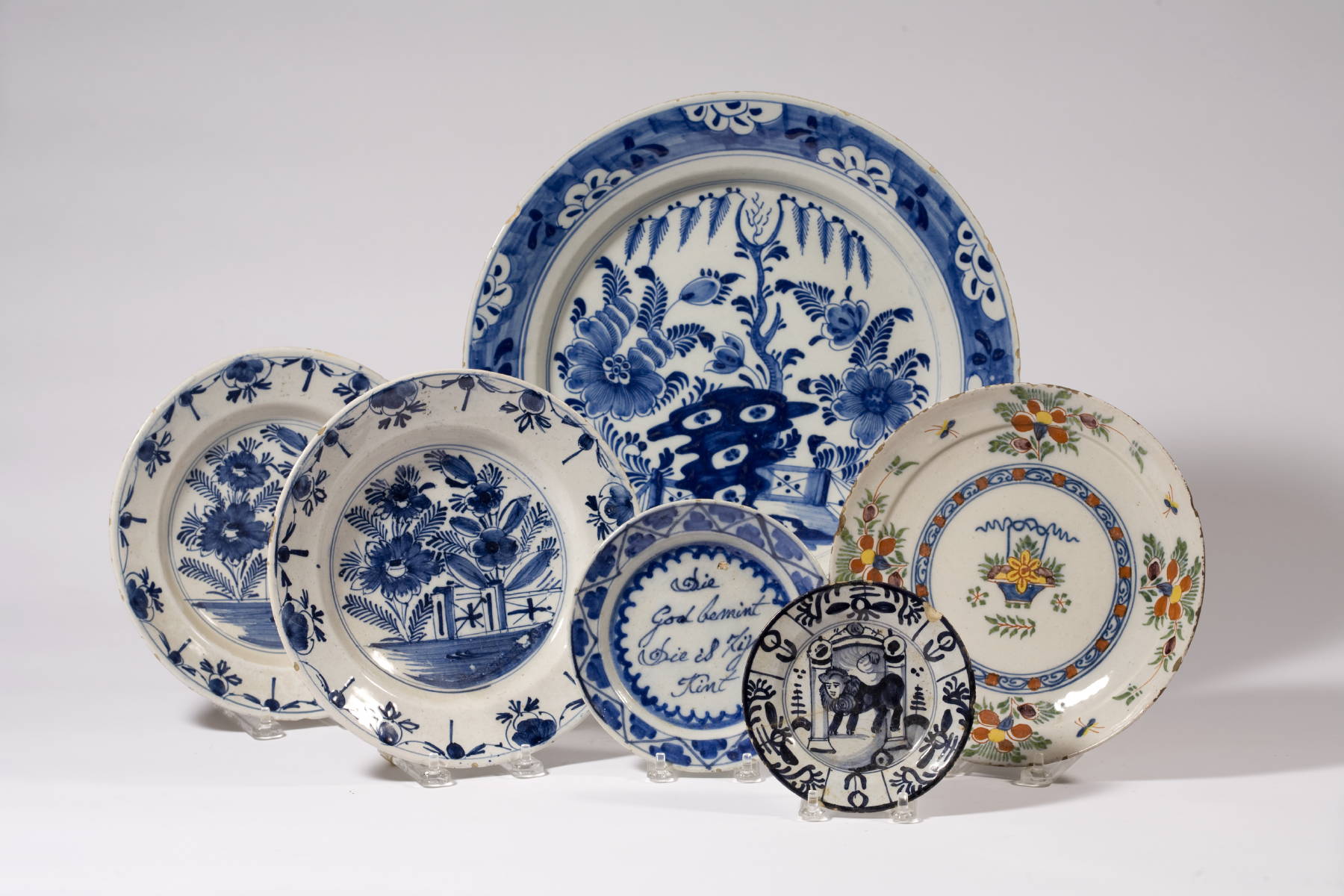 Appraisal: DUTCH DELFT BLUE AND WHITE CHARGER AND FIVE PLATES INCLUDING