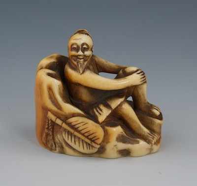 Appraisal: A Carved Ivory Netsuke of a Man Relaxed Edo Period