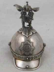 Appraisal: A Russian silver lobstertail helmet surmounted by a double headed