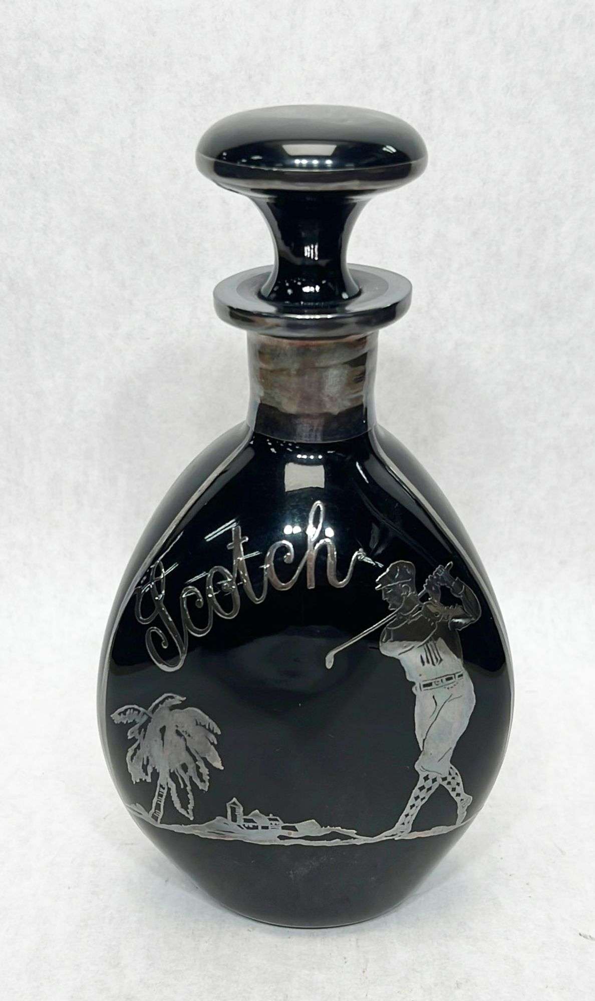 Appraisal: Black Amethyst and Sterling Silver Overlay Golf Decanter tall Condition