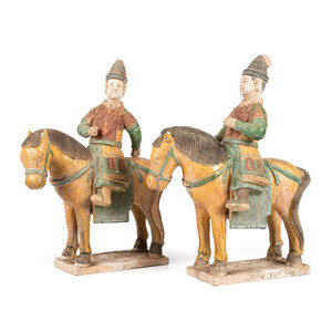 Appraisal: A Pair of Chinese Terracotta Equestrian Figures each having a