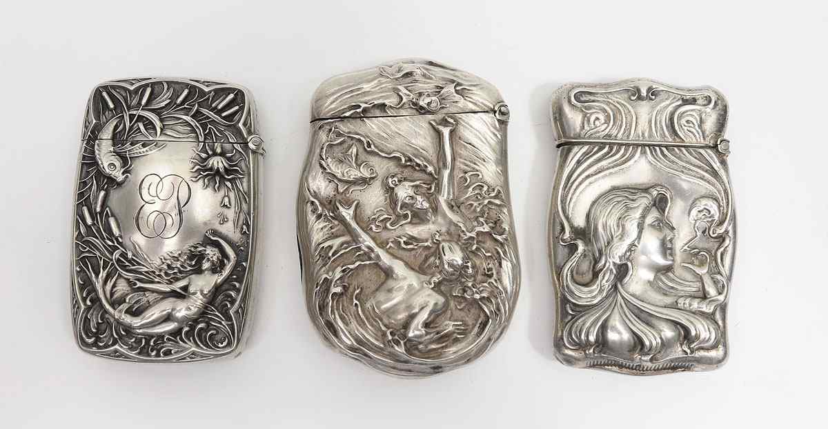 Appraisal: ART NOUVEAU STERLING SILVER MATCH SAFES To include Two woman