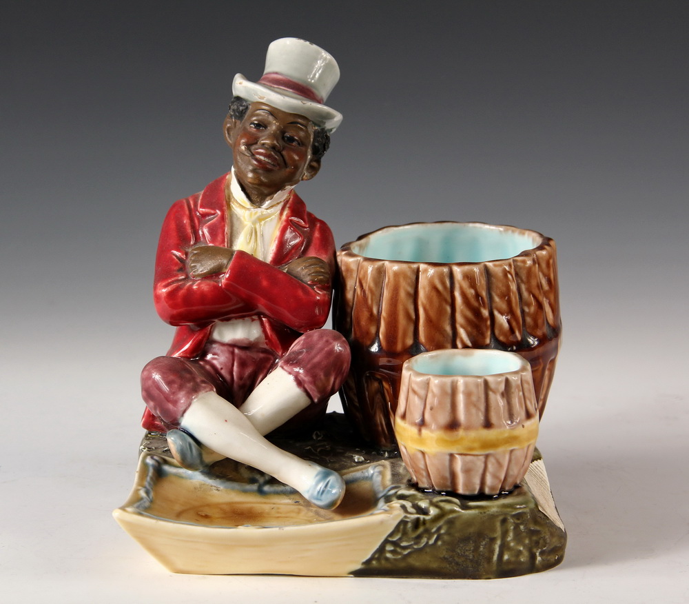 Appraisal: MAJOLICA FIGURAL SMOKING STAND - American Advertising Piece with Black