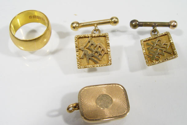 Appraisal: Pair of Chinese gold cufflinks ct gold locket and a