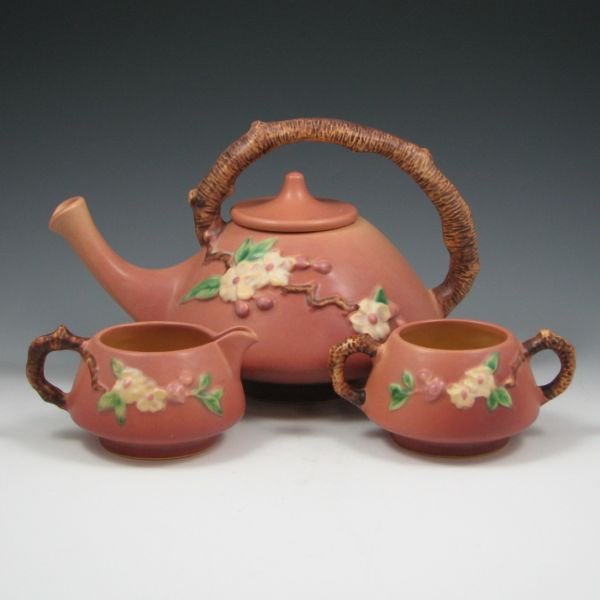 Appraisal: Roseville Apple Blossom tea set in pink with lidded teapot