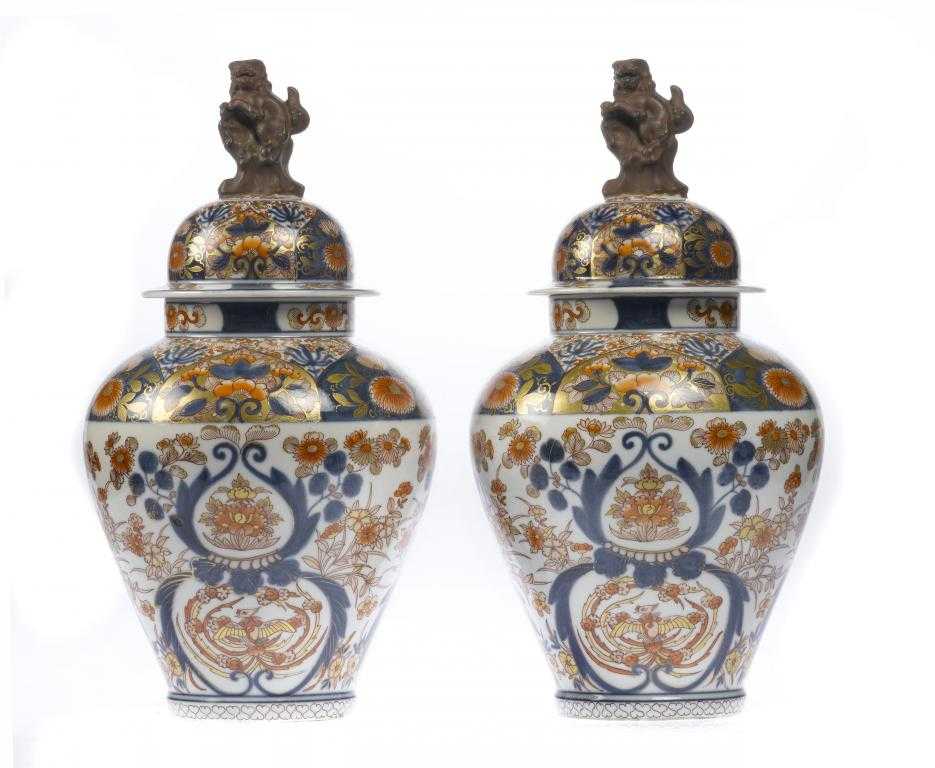 Appraisal: A PAIR OF JAPANESE IMARI VASES AND COVERS of tapered