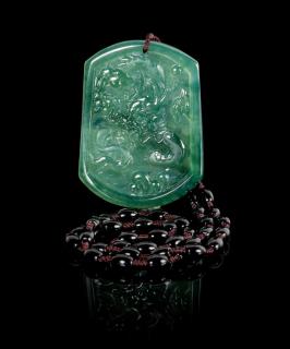 Appraisal: A Carved Jadeite Pendant A Carved Jadeite Pendant showing a