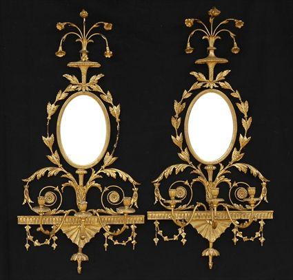 Appraisal: PAIR OF GEORGE III CARVED GILTWOOD THREE-LIGHT WALL APPLIQUES Each