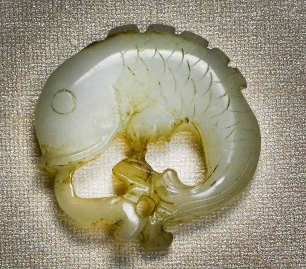 Appraisal: Chinese Qing Carved Celedon Jade PendantFinely carved to depict a