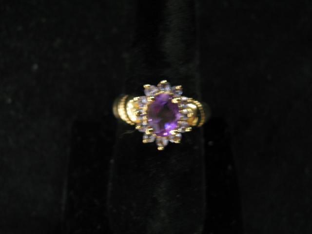 Appraisal: Amethyst Tanzanite Ring oval gem surrounded by round tanzanites k