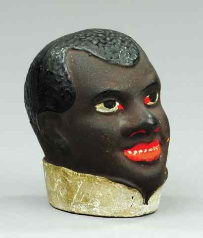 Appraisal: SMILING BLACK MAN STILL BANK Redware example done in c