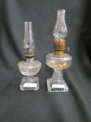 Appraisal: Miniature Oil Lamps clear pedestal bases with chimneys tallest is